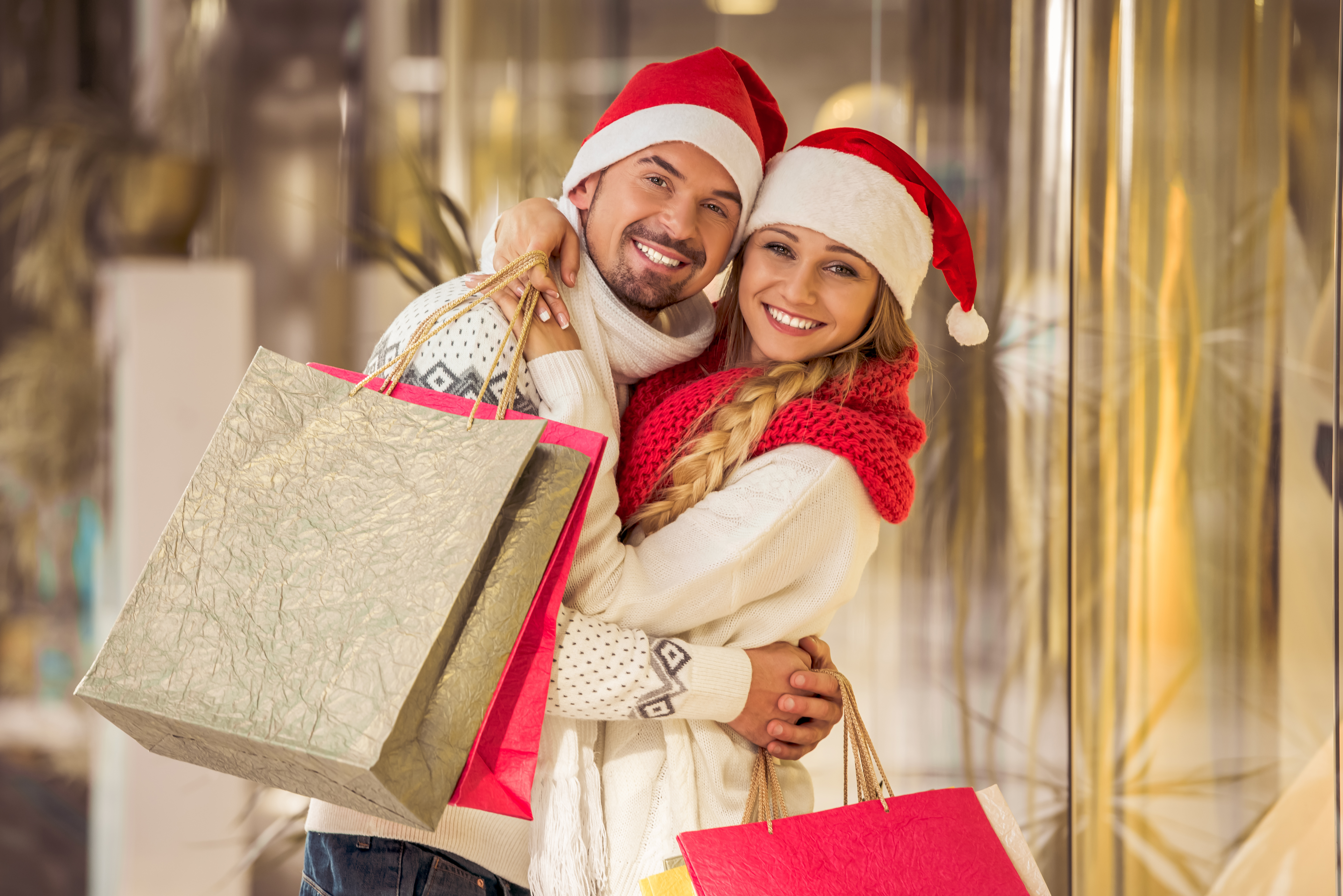 couple with holiday shopping bags